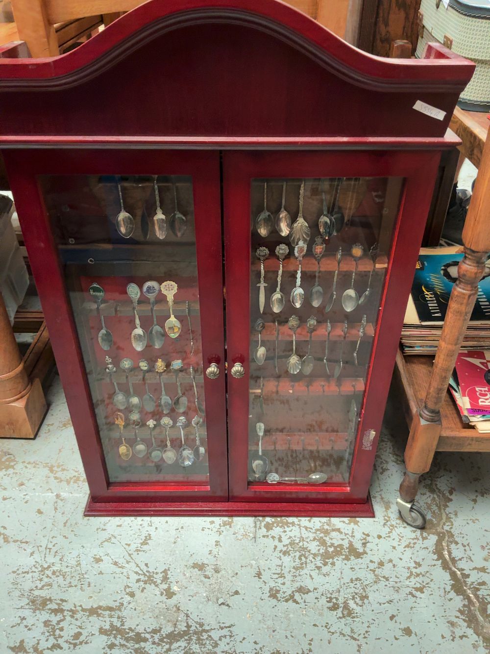 Lot 278: A Collection of Souvenir Spoons in a Glazed Wall-Hanging Display Cabinet
