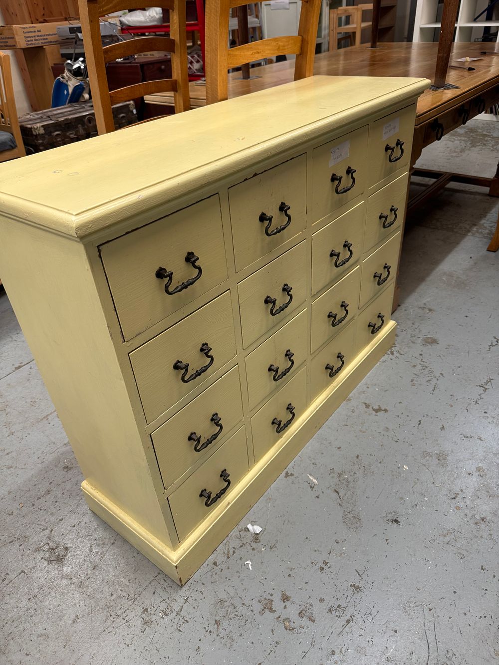 Lot 288: A 20th-century painted bank of sixteen drawers