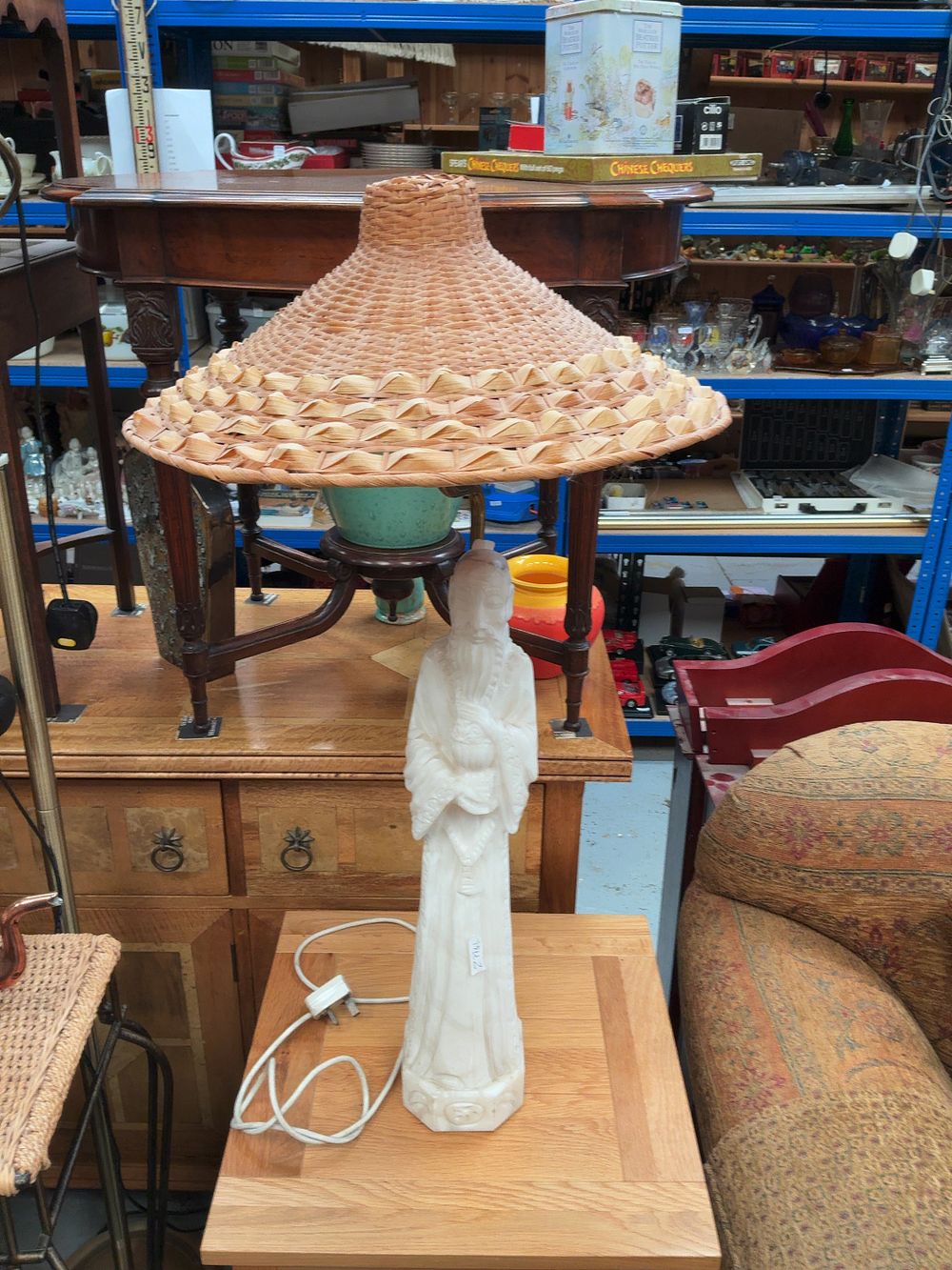 Lot 301: Mid-20th-Century Chinoiserie Carved Alabaster Figural Lamp with Woven Wicker Shade