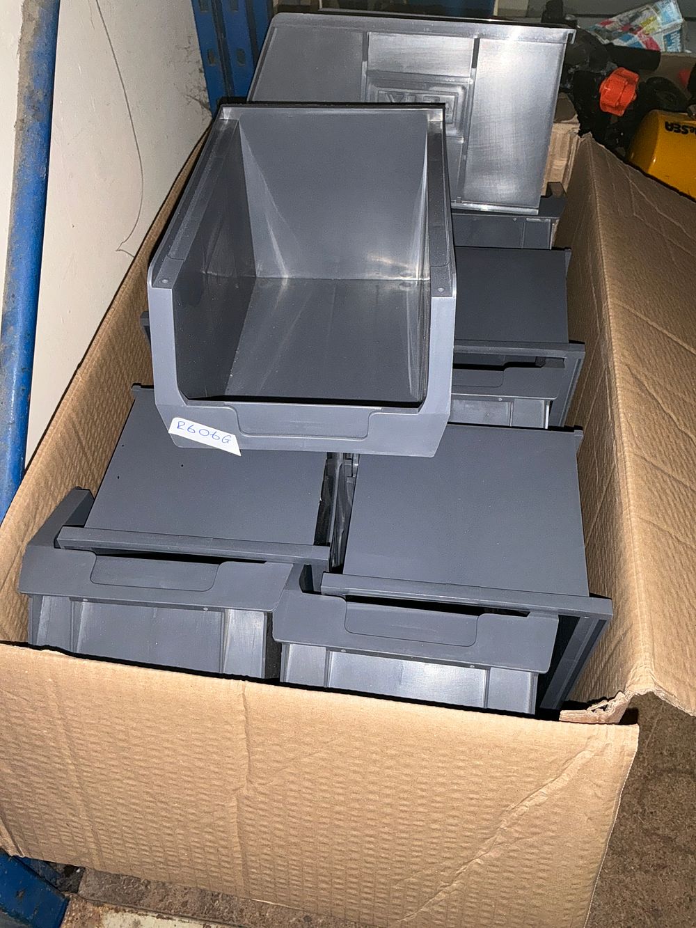 Lot 332: An Assortment of Grey Plastic Industrial Stackable Storage Bins