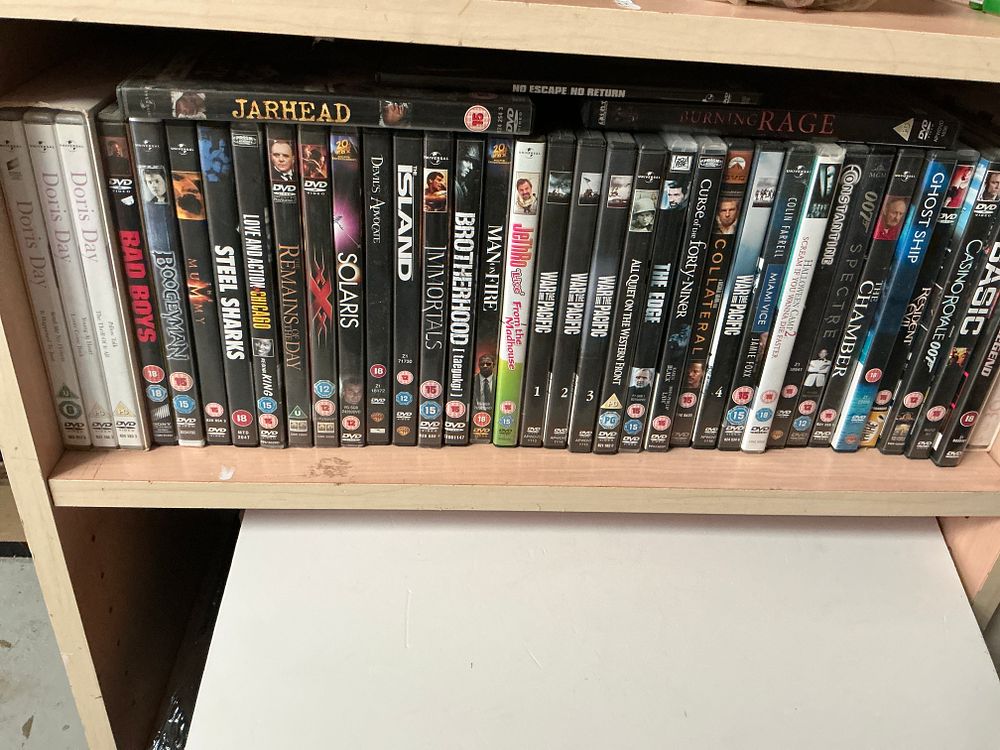 Lot 338: A Collection of Approximately 40 DVD Films Including Action, Drama, and War Documentary Titles