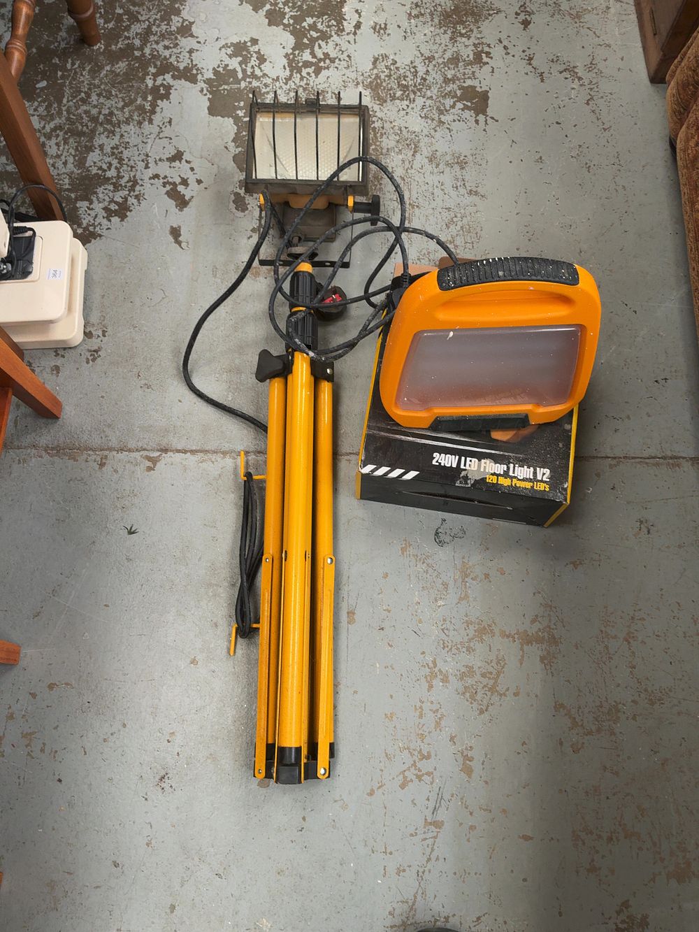Lot 367: Two Portable Site Work Lights Comprising a Clarke Halogen Tripod Light and a Defender LED Floor Light