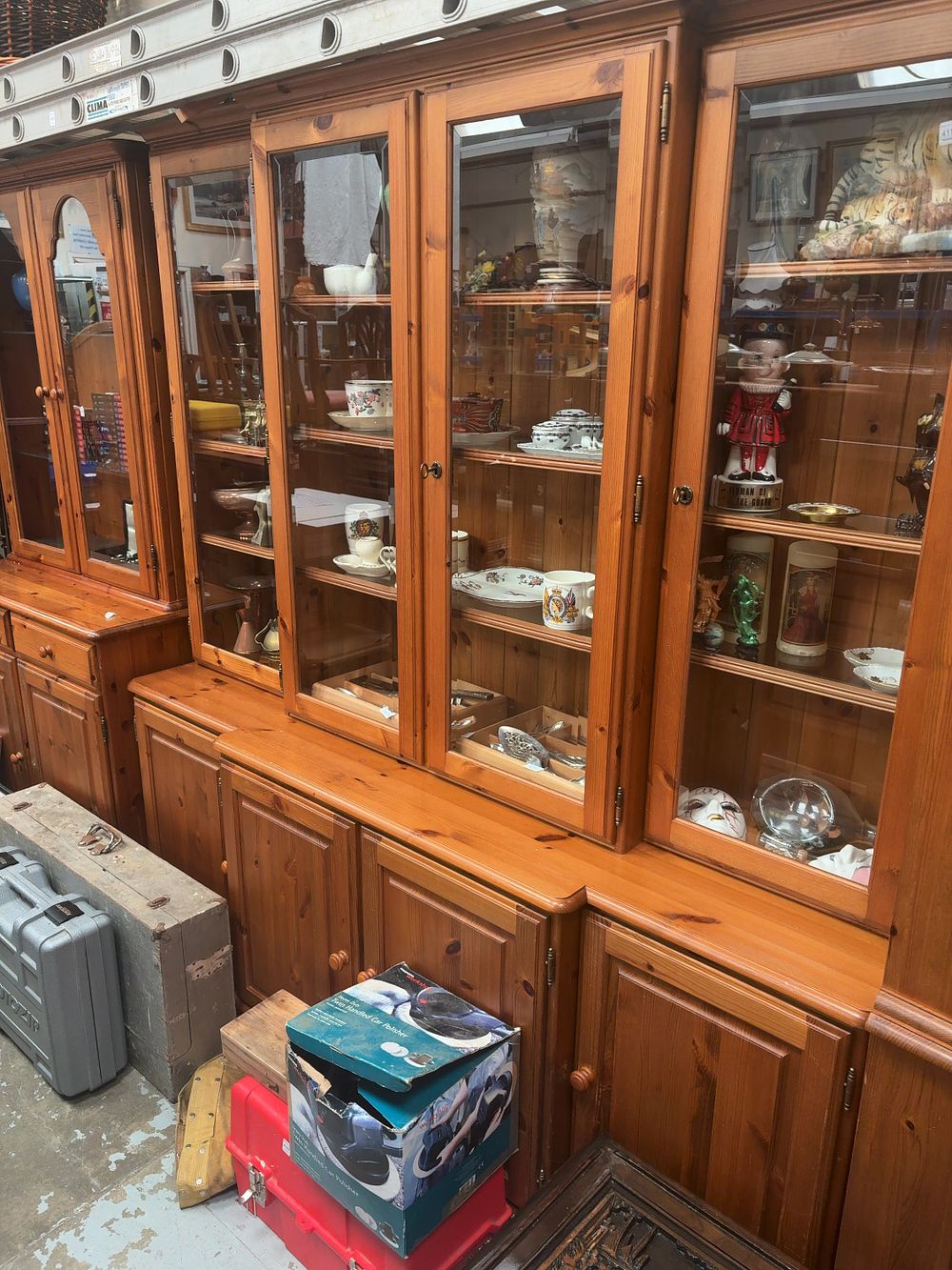 Lot 418: A Large Modular Two-Piece Pine Glazed Unit and Base Cupboard