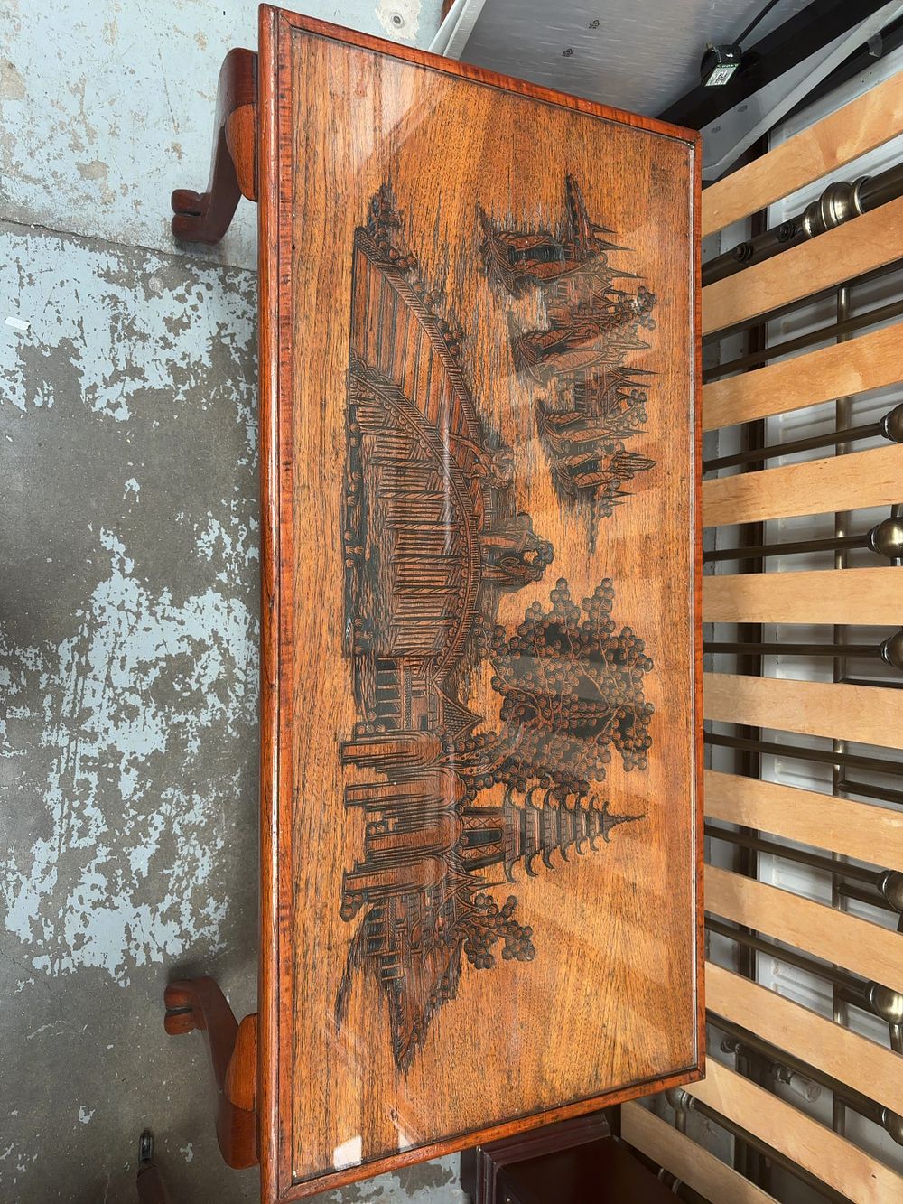 Lot 428: A Mid-20th Century Oriental Style Stained Hardwood Coffee Table with Carved Landscape Top
