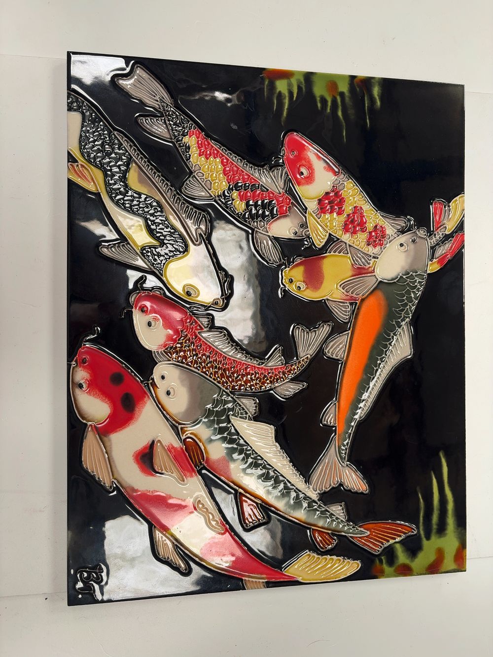 Lot 441: A contemporary Benaya tube-lined ceramic wall plaque depicting koi carp