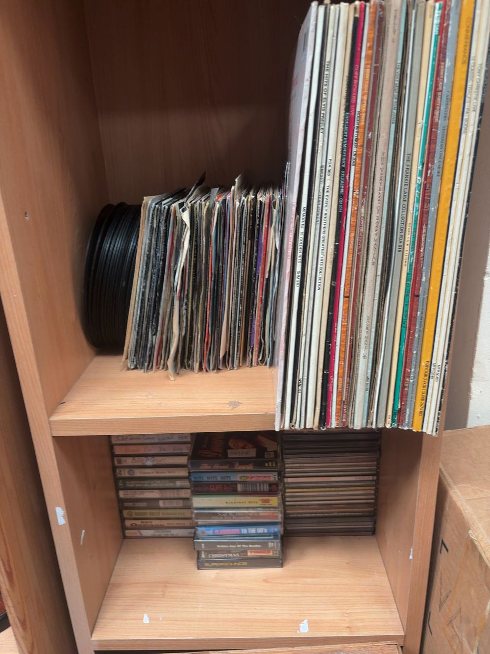 Lot 149: A Collection of Vintage Music Media including Vinyl LP Records, 7-inch Singles, Cassette Tapes, and Compact Discs