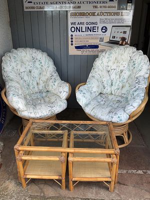 A pair of Natural Rattan Swivel Rocking Conservatory Chairs and Nesting Tables. A contemporary 