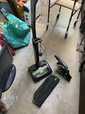 A Collection of Gtech Cordless Vacuum Cleaning Appliances and Accessories. A collection of Gtech 