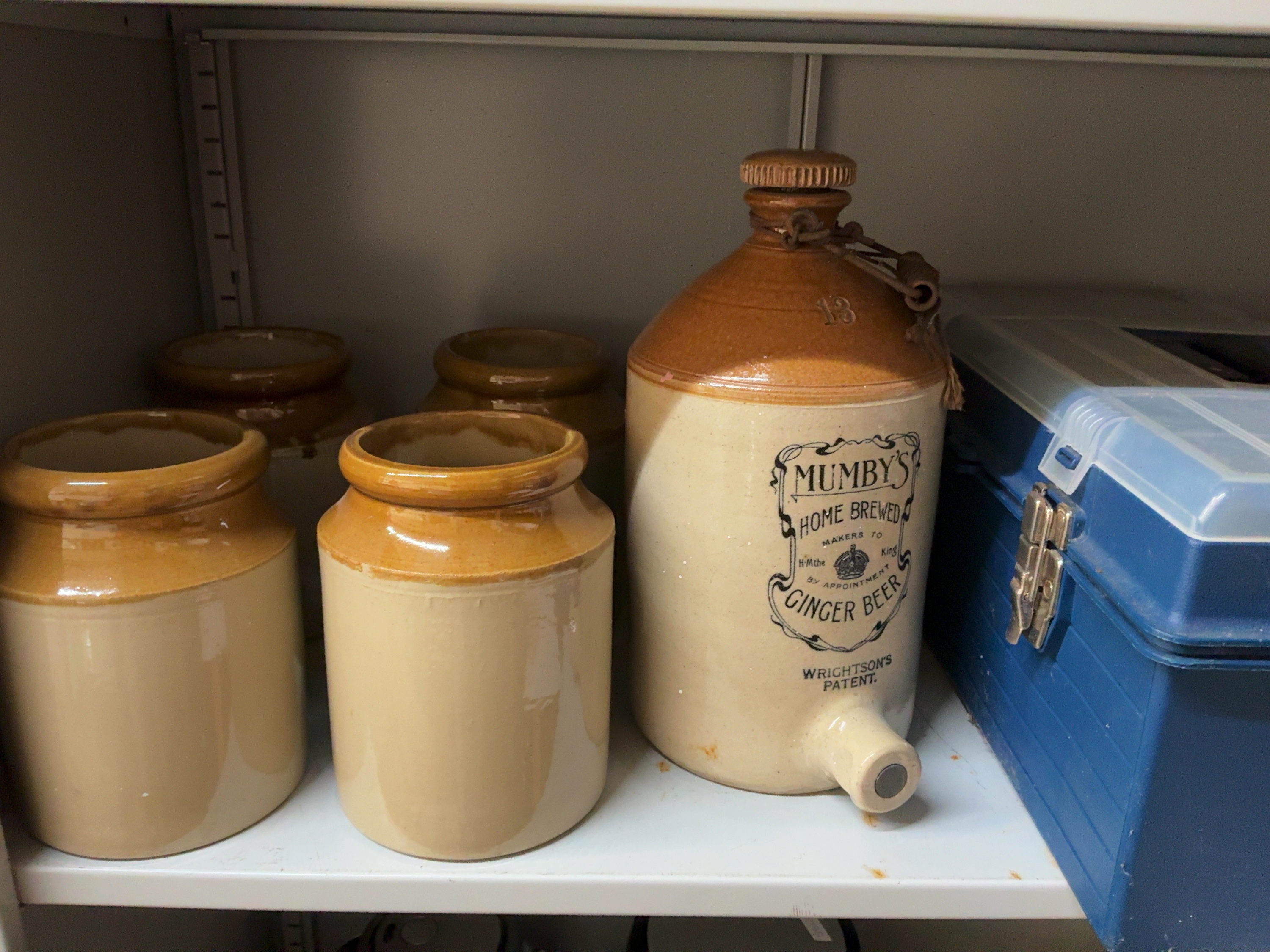 A Collection of Two-Tone Stoneware Vessels including a Mumby's Ginger Beer Flagon and Workshop Storage Containers