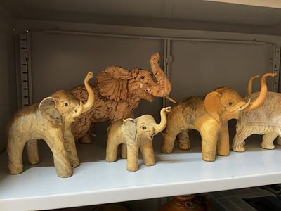 A Collection of Seven Decorative Elephant Figurines Including Crushed Oyster Shell and Bark 