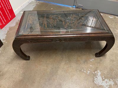 A Mid-20th Century Chinese Carved Hardwood Coffee Table with Inset Glass Top. A mid-20th-century 