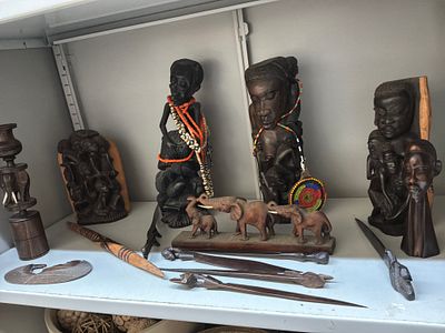 An Assortment of East African Carved Hardwood Figures and Traditional Beadwork Jewellery. A 