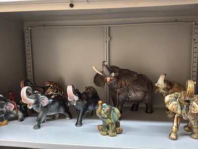 A Collection of Eleven Ceramic and Metallic Elephant Figurines including Royal Dux, Beswick 