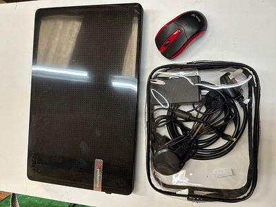 A Packard Bell EasyNote TS Laptop with Wireless Mouse and Power Cables. A used Packard Bell 