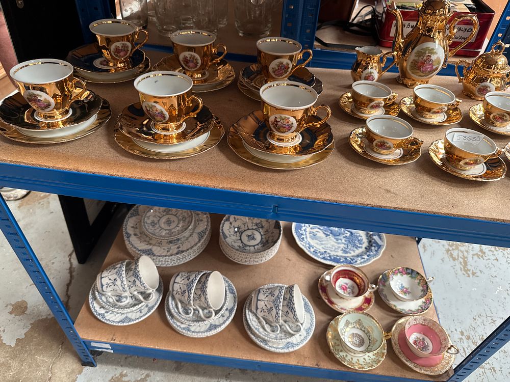 Lot 179: A Collection of Decorative Ceramics including a Gilded Fragonard-Style Coffee Service and Blue and White Tableware