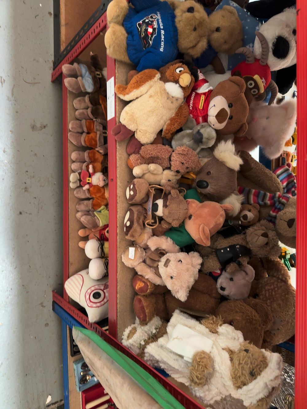 Lot 186: A Collection of Assorted Plush Toys and Decorative Soft Goods including Honda Racing and Disney Character Merchandise