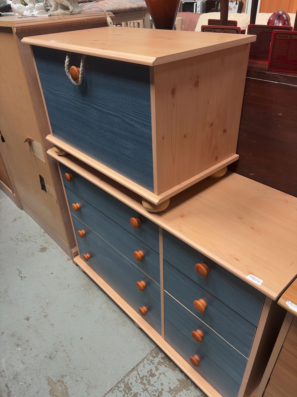 Lot 261: A pair of contemporary knotty pine and blue-stained furniture items comprising a chest of drawers and a storage chest