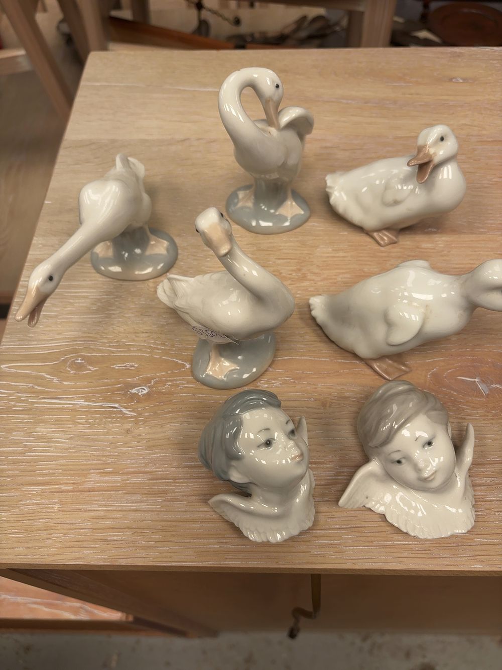 Lot 262: An Assortment of Lladro and Nao Porcelain Figurines and a Table Lamp