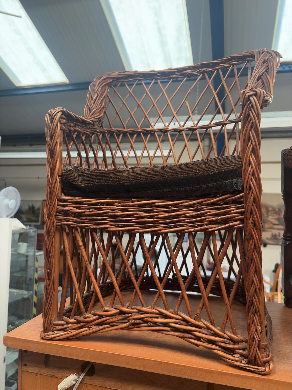 Lot 266: Two Items of Child's or Doll's Furniture comprising a Woven Willow Armchair and a Rush-Seated Stool