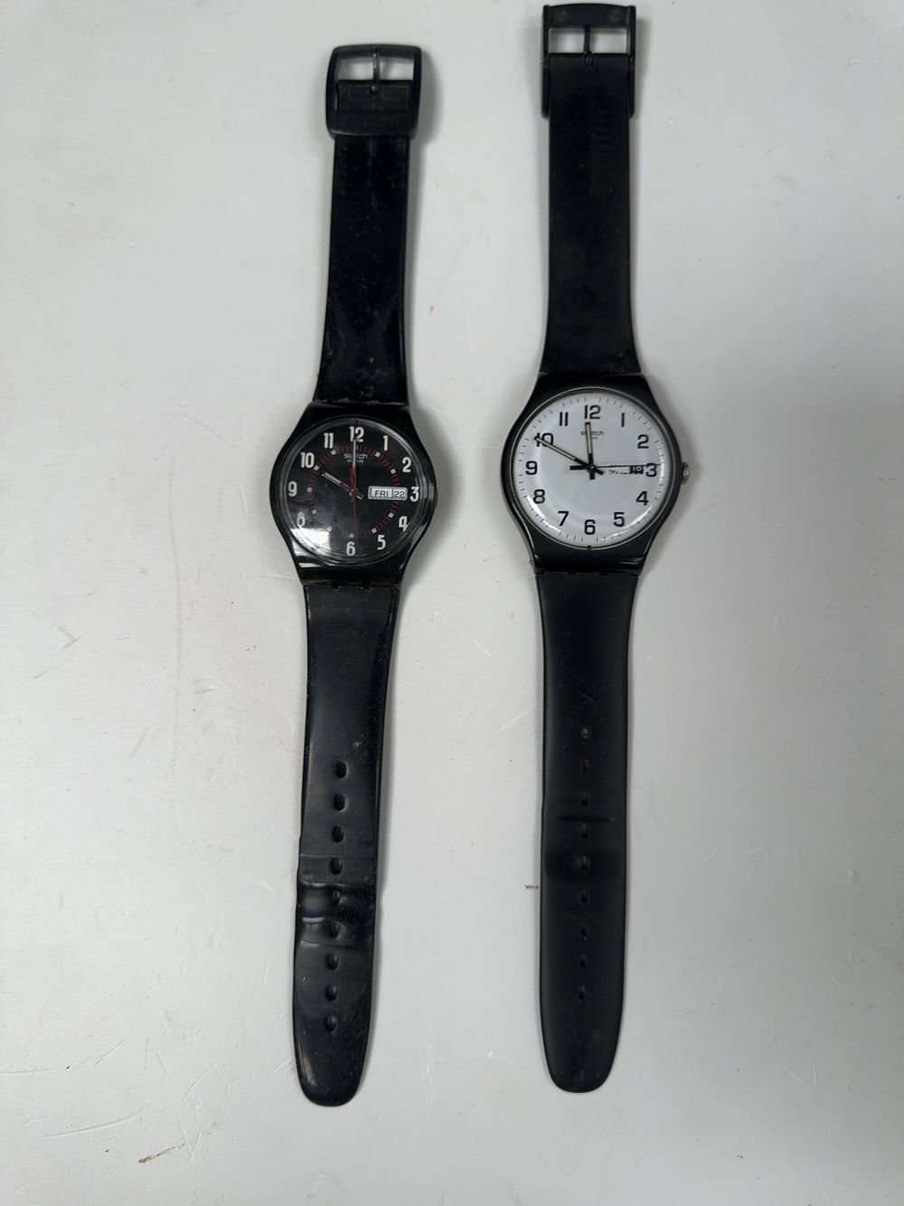 Lot 277: A Pair of Swatch Quartz Wristwatches, including Twice Again and Black Friday Models