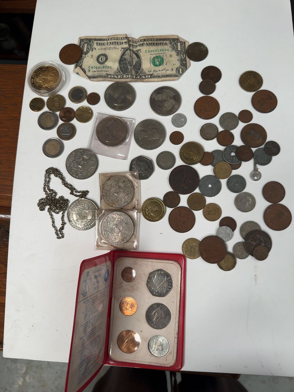 Lot 278: A Collection of US, UK, and World Coins, Currency, and Medals