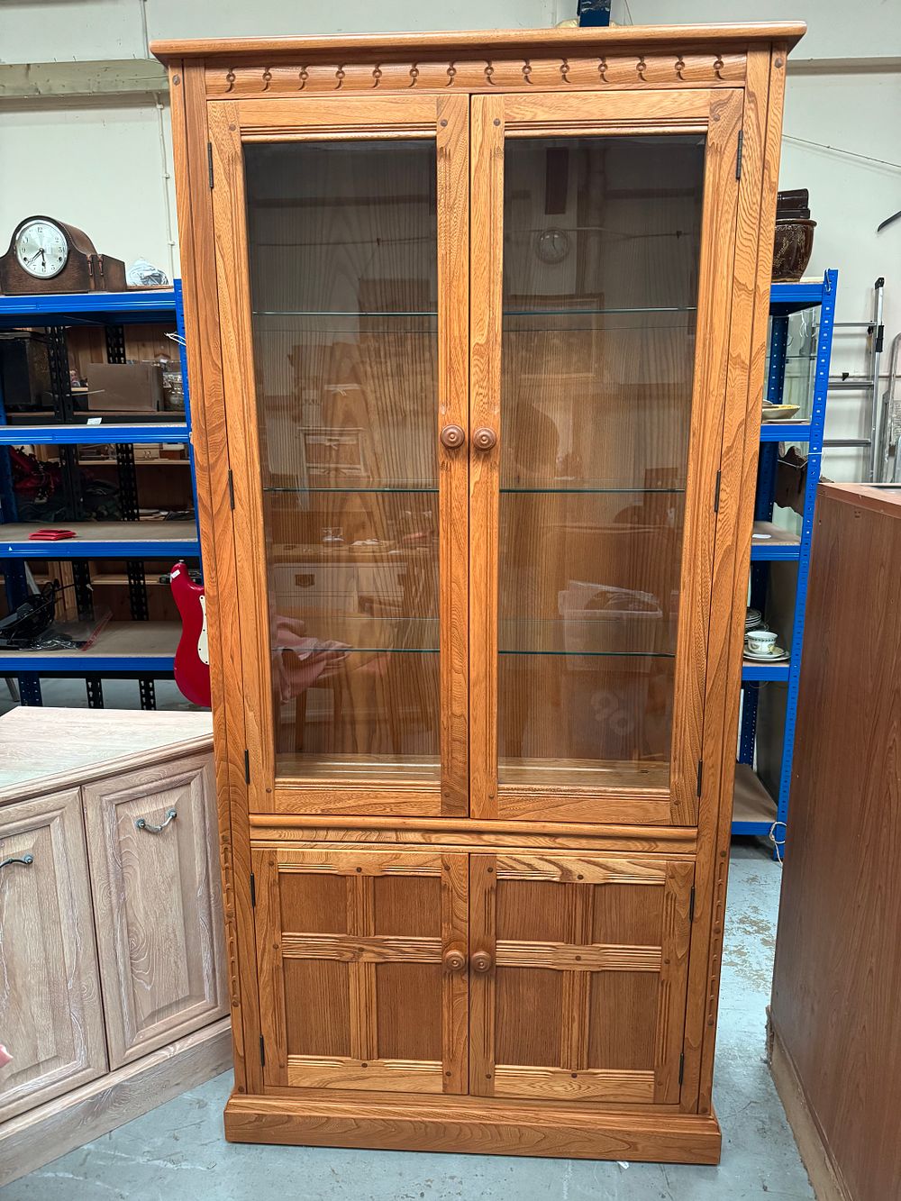 Lot 286: Ercol Old Colonial Elm Glazed Display Cabinet