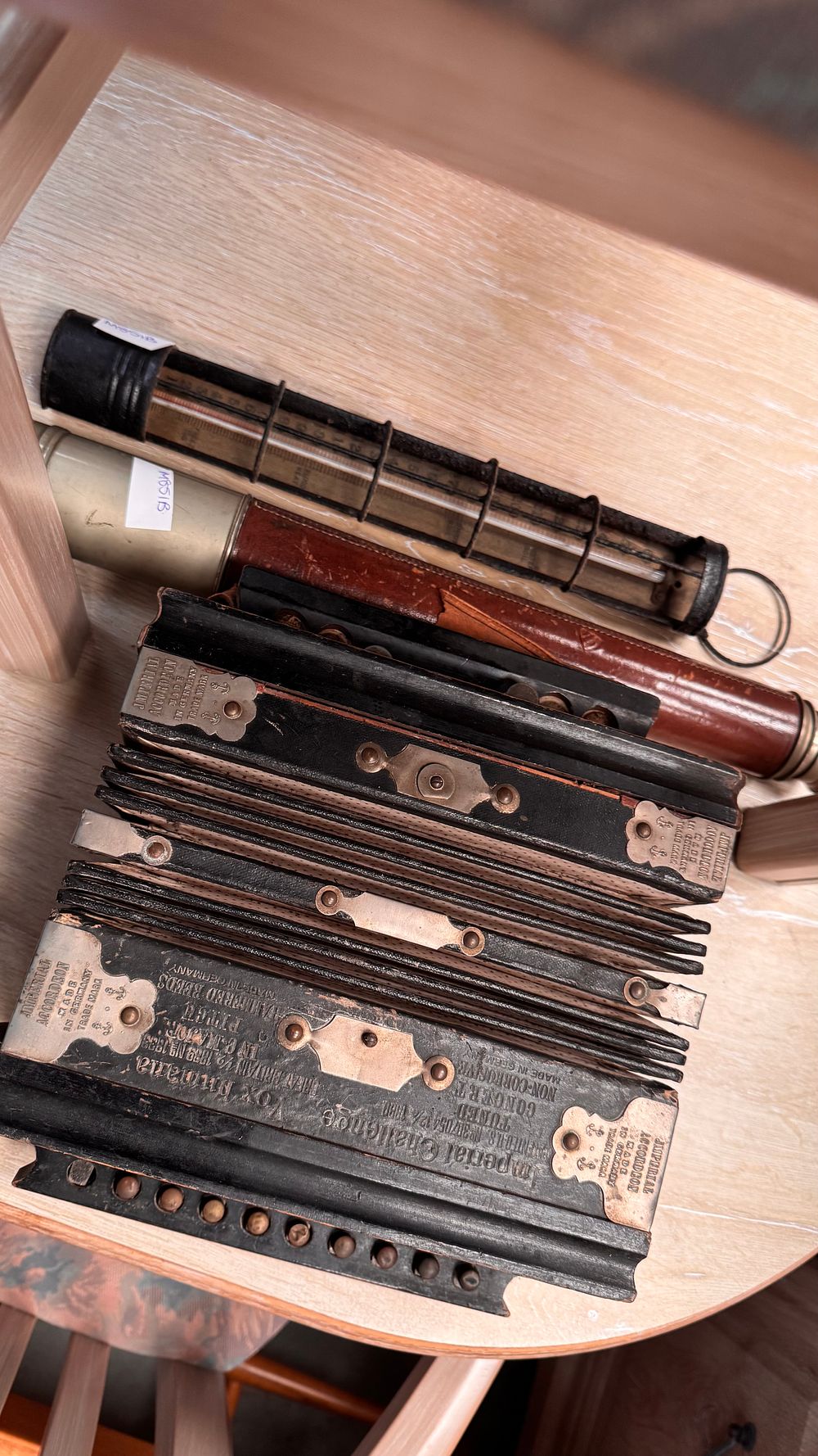 Lot 291: A Trio of Antique Instruments Comprising an Imperial Accordeon Vox Humana Melodeon, a Marine Telescope, and an Industrial Cage Thermometer