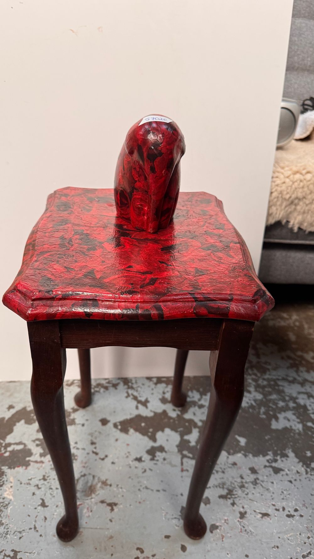 Lot 297: A reproduction wooden side table and a matching stylized ceramic elephant figure