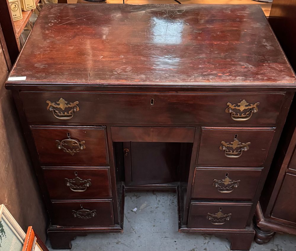 Lot 304: A George III Mahogany Kneehole Desk