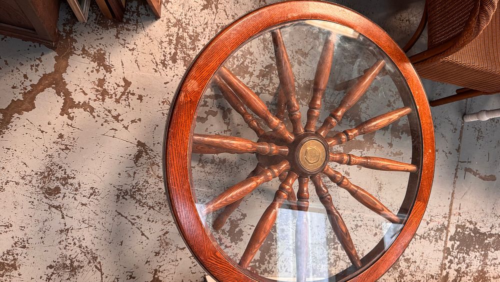 Lot 305: A mid-20th century nautical themed ship's wheel coffee table with glass top