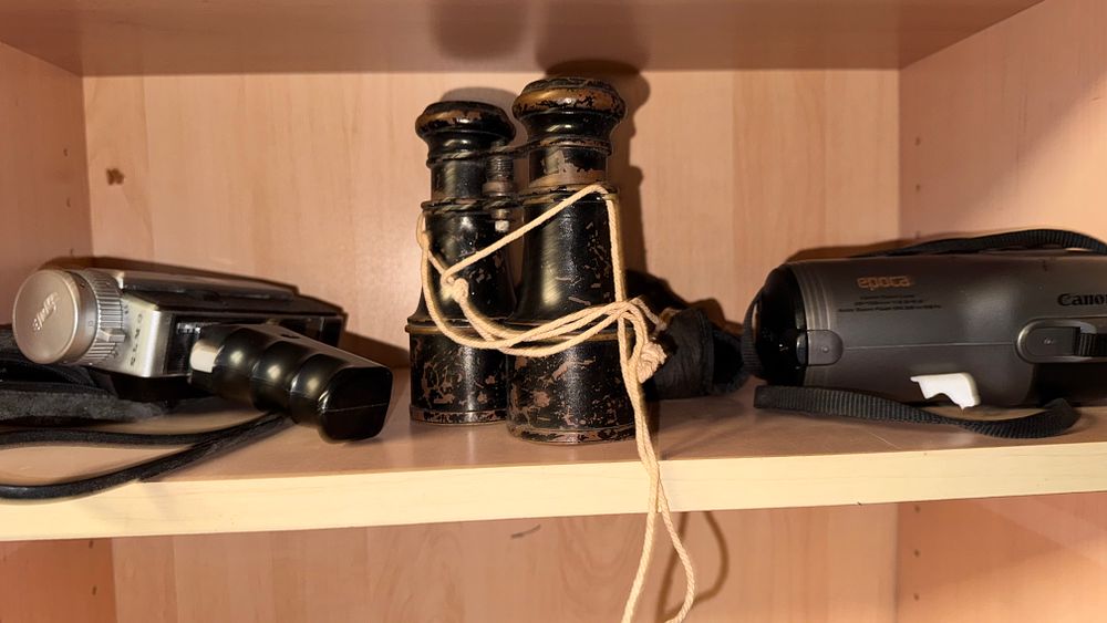 Lot 314: A Trio of Optical and Photographic Equipment including French Style Field Glasses, an Elmo Movie Camera and a Canon Epoca 35mm Camera