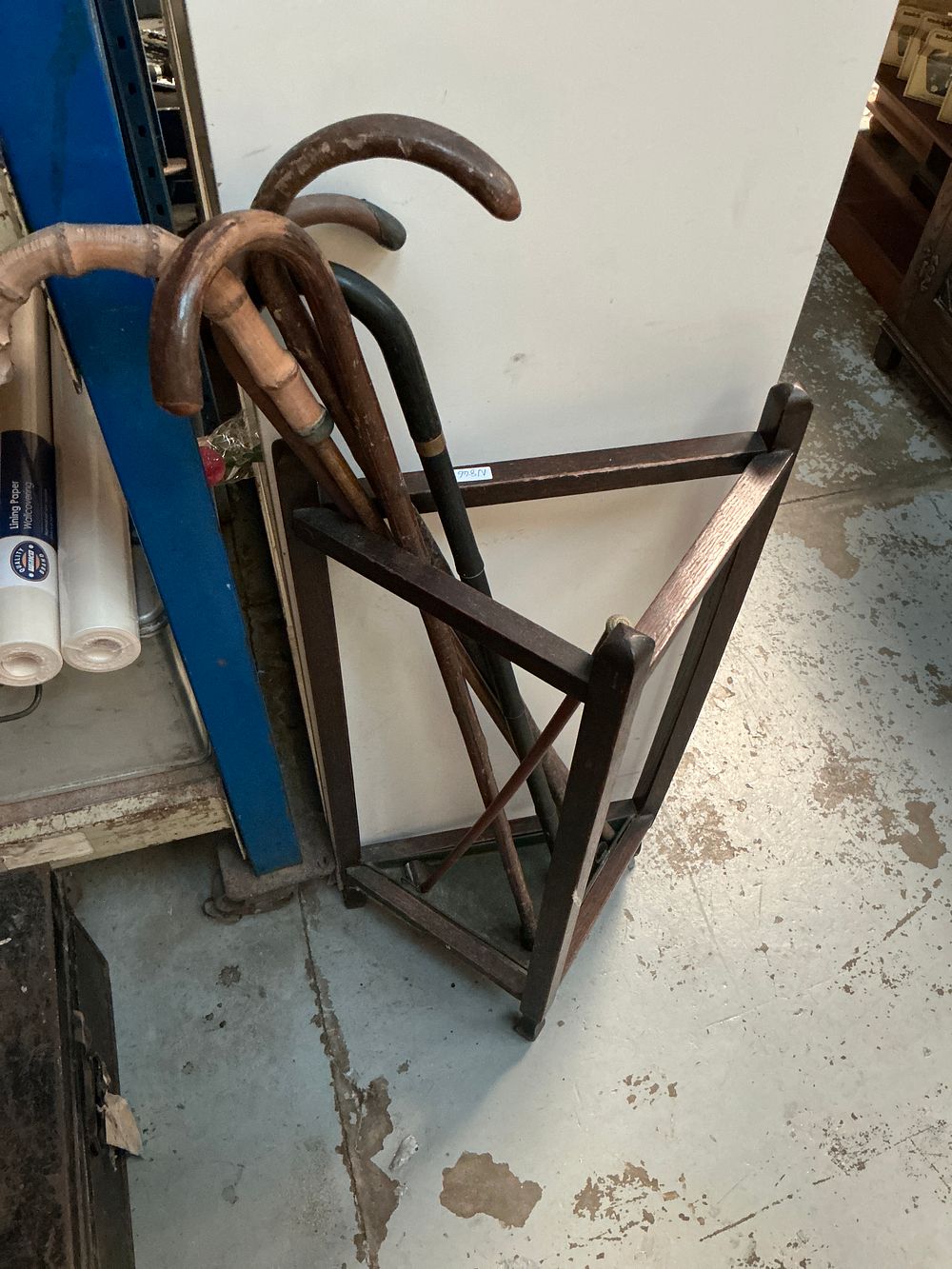 Lot 317: A Collection of Walking Sticks and a Triangular Wood Hall Rack