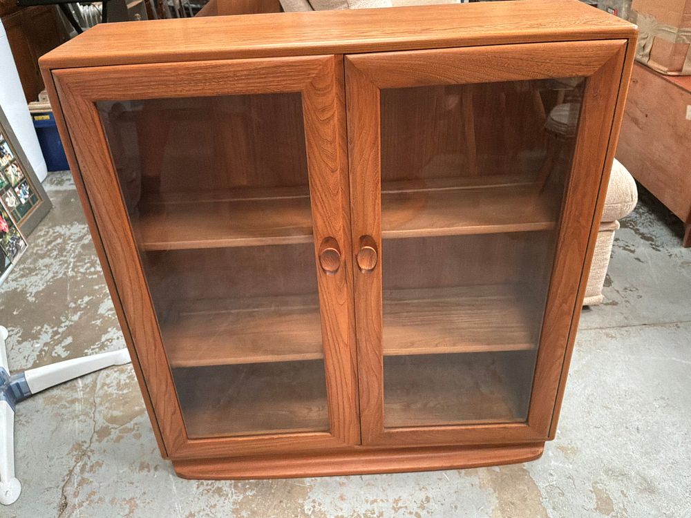 Lot 345: Ercol Windsor Style Mid-Century Elm and Beech Glazed Display Cabinet
