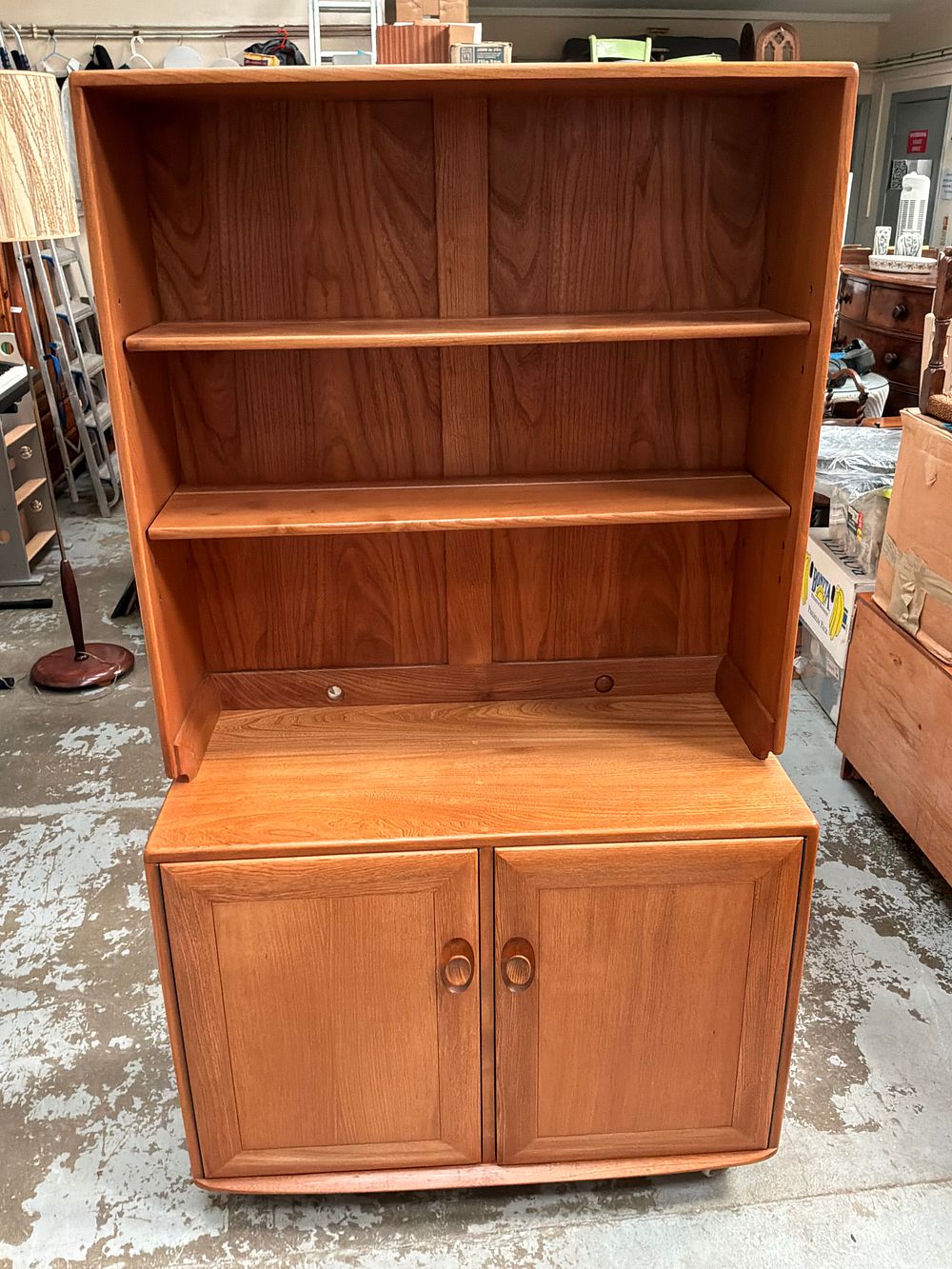 Lot 346: An Ercol Windsor Mid-Century Elm and Beech Two-Part Wall Unit