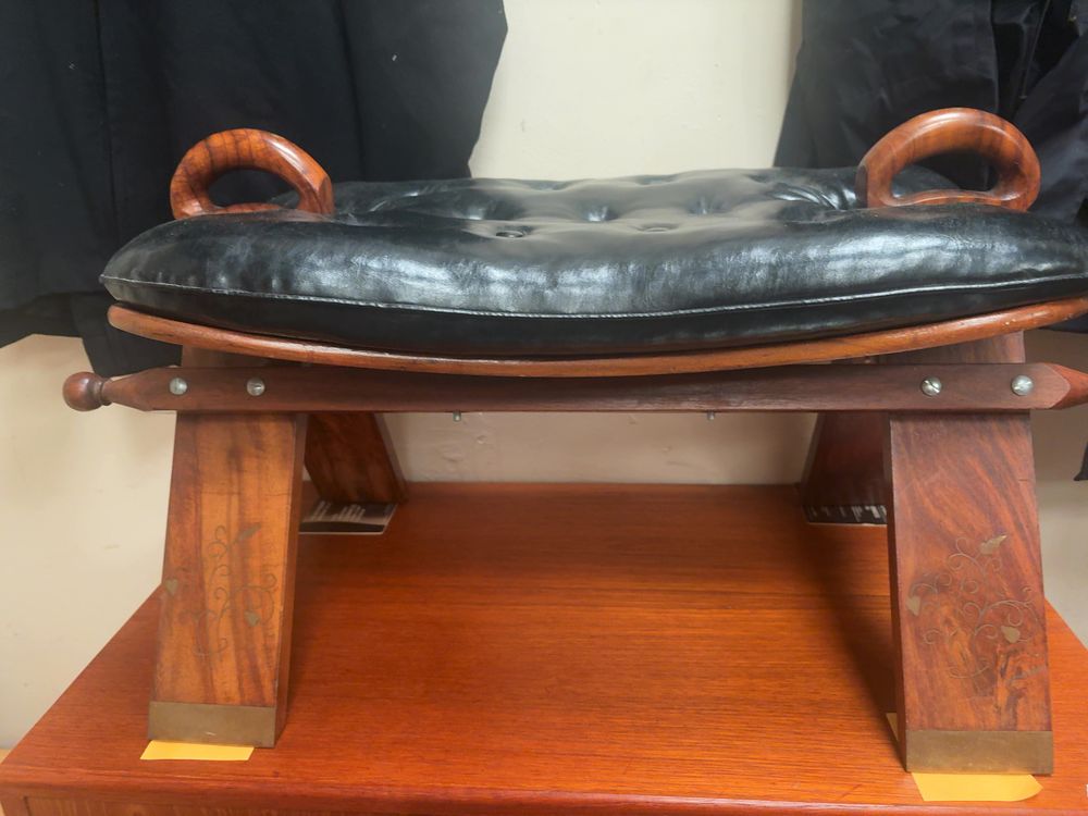 Lot 352: A Mid-20th Century Anglo-Indian Style Brass Inlaid Camel Stool