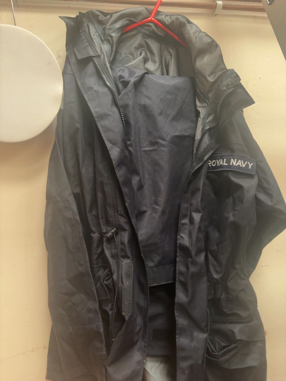 Lot 357: A Collection of Contemporary Royal Navy Ratings' Uniform Items and Foul Weather Gear including Submarine Service