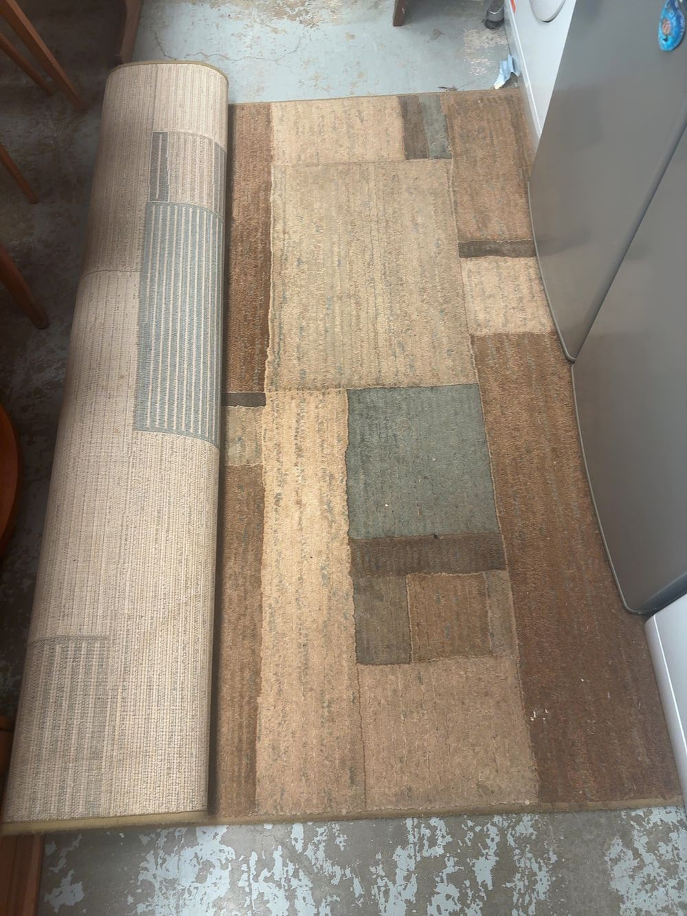 Lot 371: A Modern Geometric Area Rug, attributed to Ashley Furniture
