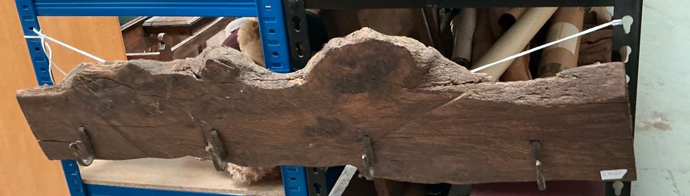 Lot 171: A Rustic Live-Edge Wooden Wall-Mounted Coat Rack with Four Metal Hooks