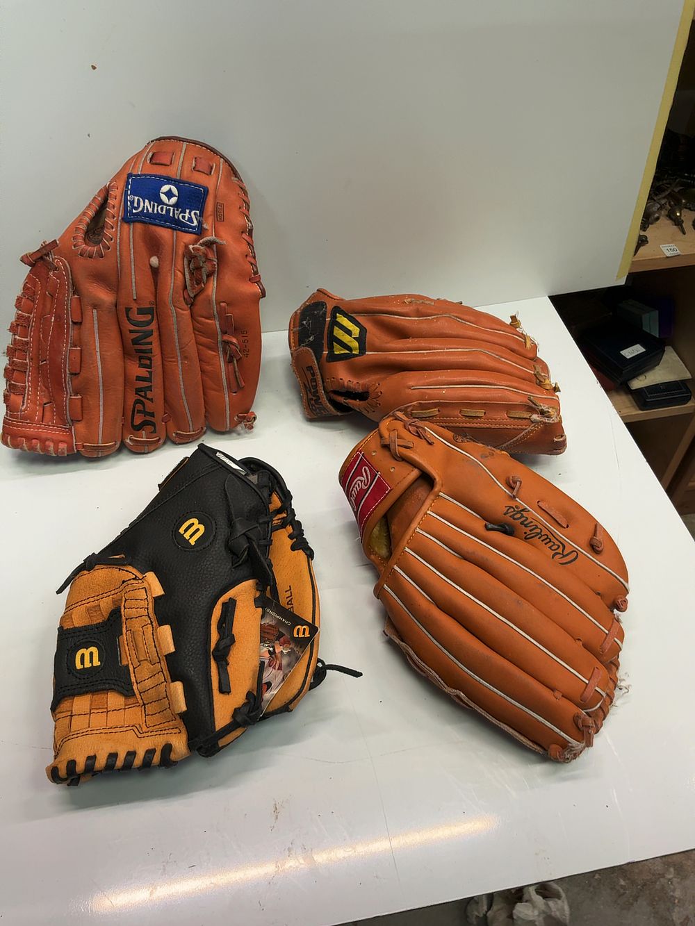 Lot 176: A Collection of Baseball and Softball Gloves including Spalding Wilson and Rawlings