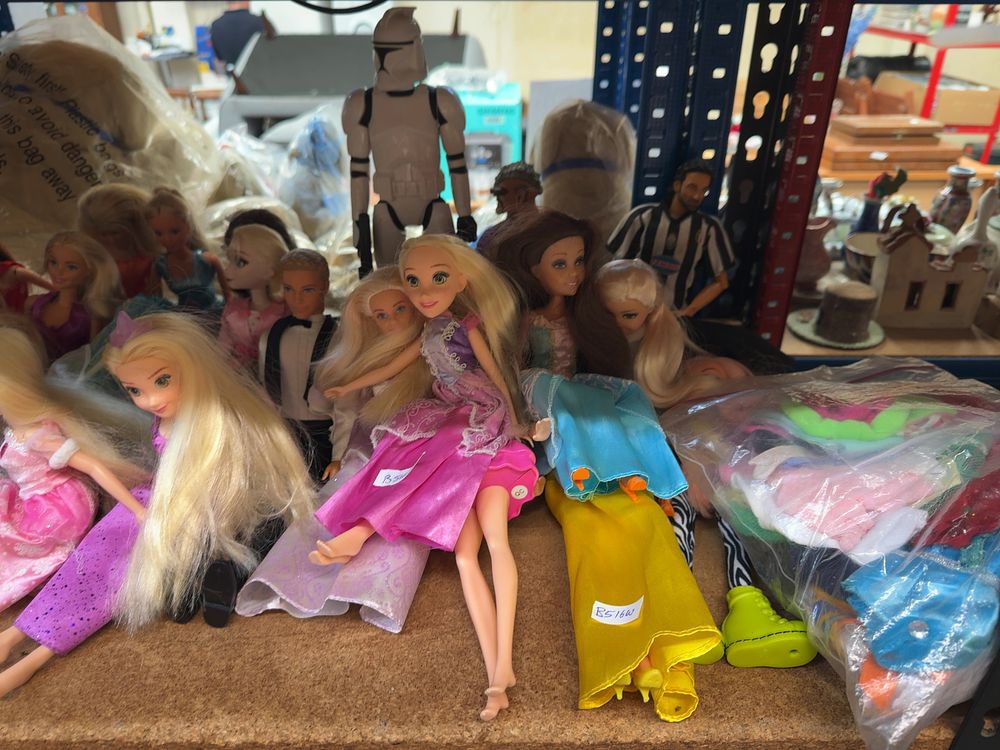 Lot 193: A Large Assortment of Contemporary Fashion Dolls, Action Figures, and Accessories