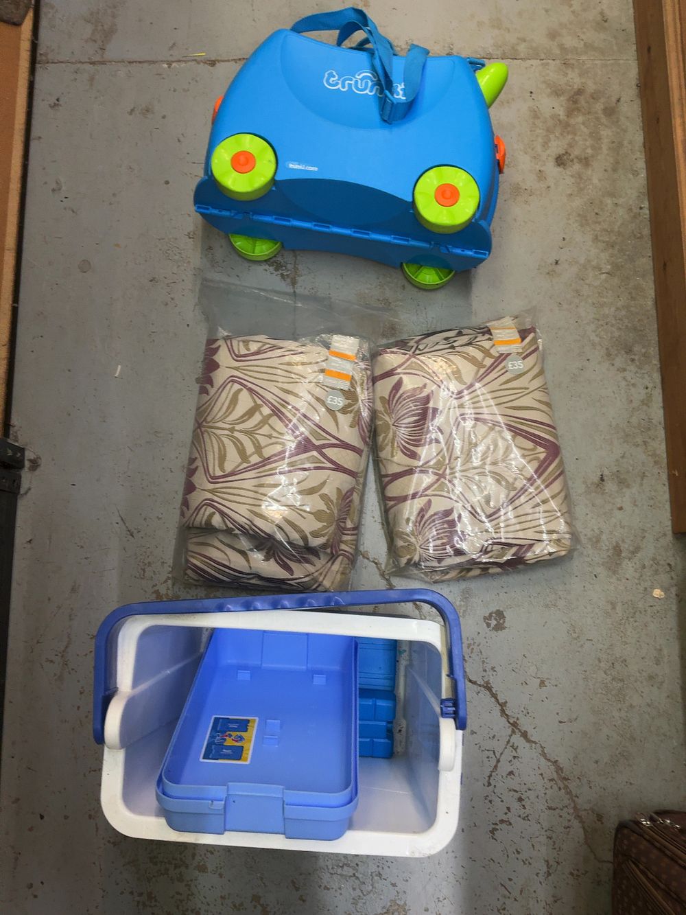 Lot 202: An Assortment of Travel and Home Goods Including a Trunki Suitcase Textiles and a Storage Container