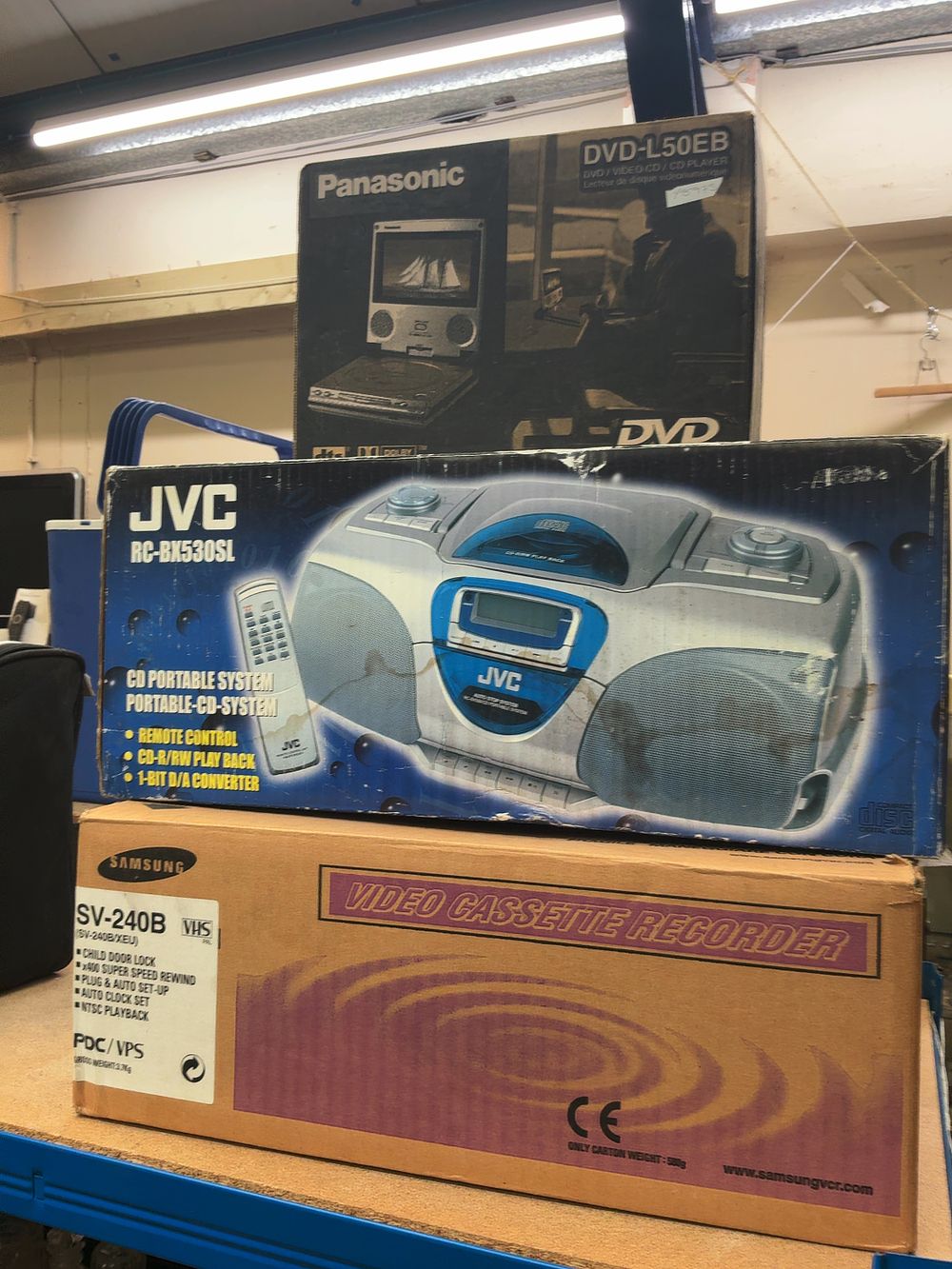 Lot 208: A Trio of Vintage Consumer Electronics comprising a Panasonic Portable DVD Player, a JVC CD Portable System, and a Samsung Video Cassette Recorder