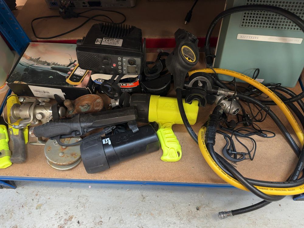 Lot 228: An Assortment of Marine Electronics, Diving Equipment, and Vintage Fishing Tackle