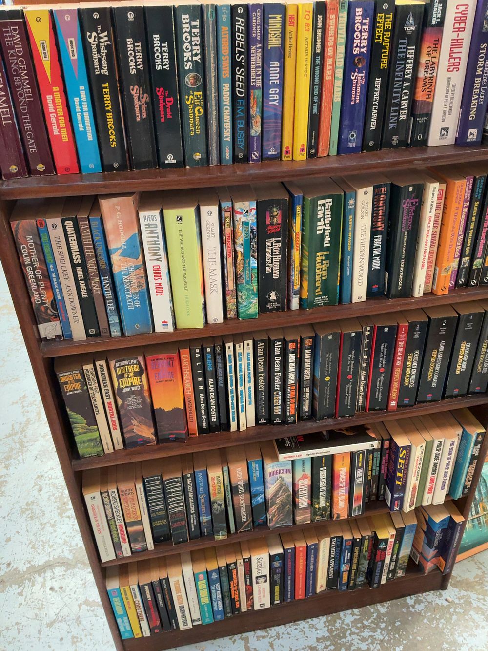 Lot 249: A Collection of Science Fiction and Fantasy Mass Market Paperbacks Featuring Significant Author Runs
