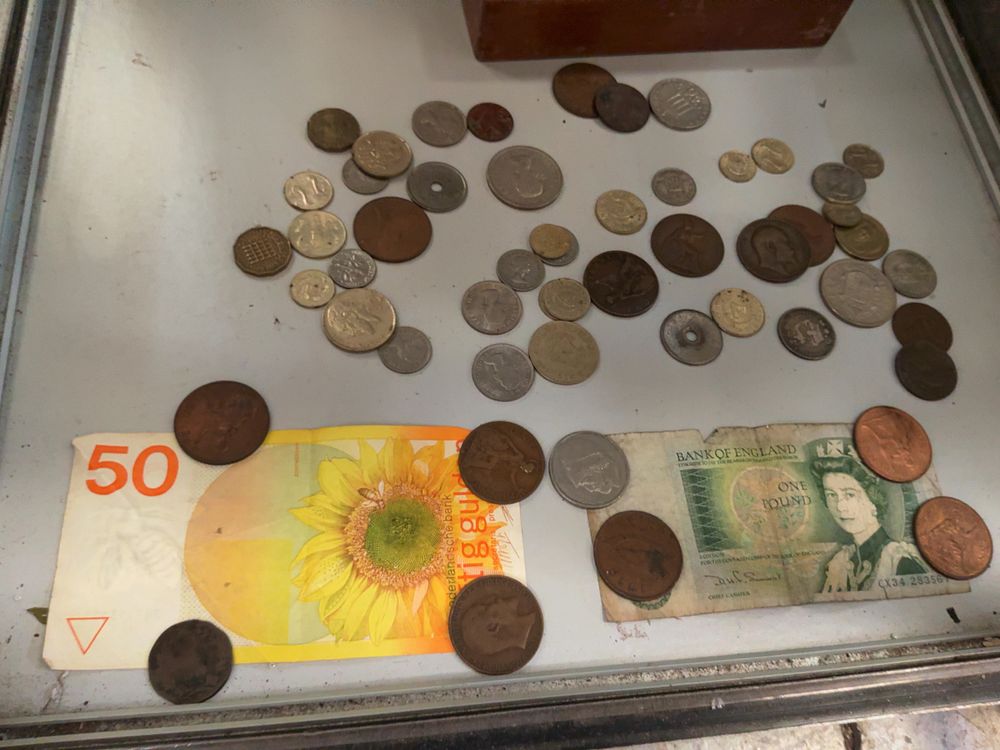 Lot 282: A Collection of UK, NL, and World Banknotes and Coins