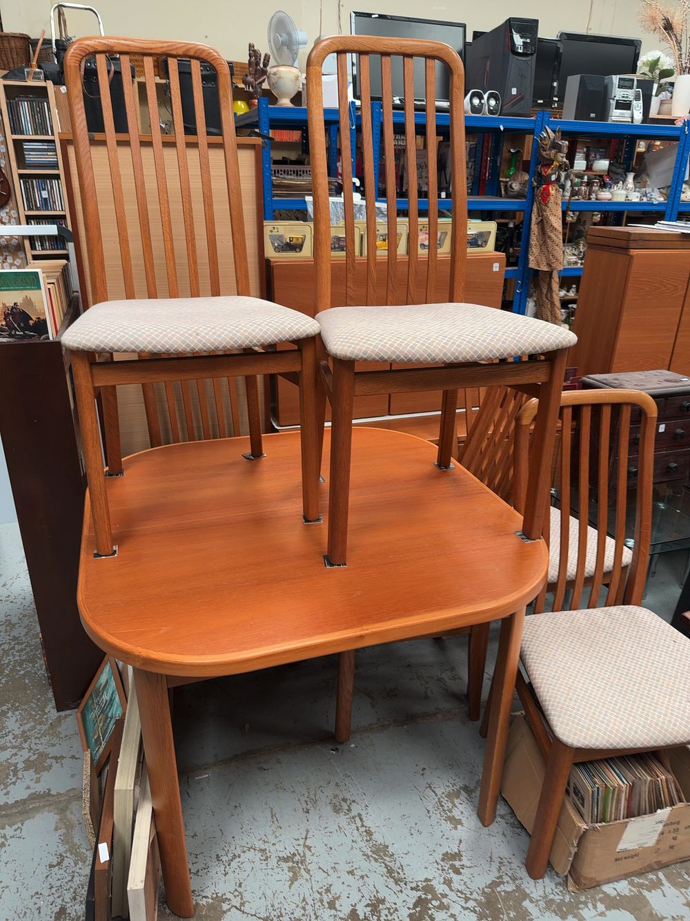 Lot 310: A Mid-Century Modern Teak Extending Dining Table and Six Chairs