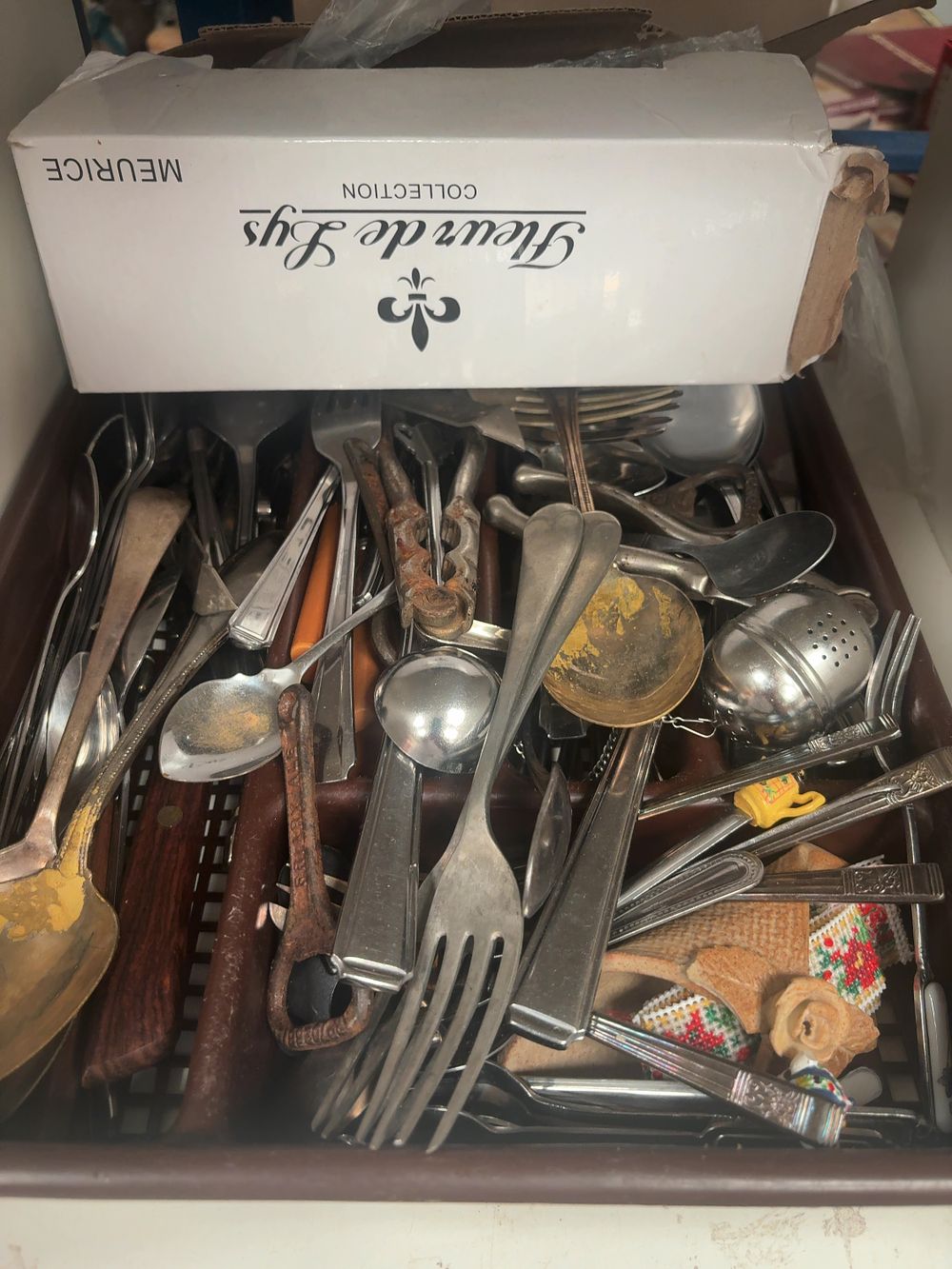 Lot 322: An Assortment of Vintage Silver-Plated and Stainless Steel Flatware and Kitchen Utensils with Meurice Fleur de Lys Box