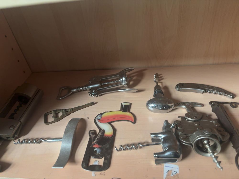 Lot 348: A Collection of Vintage and Antique Corkscrews and Bottle Openers including a Zig Zag Multi-Lever Extractor and Guinness Advertising Opener