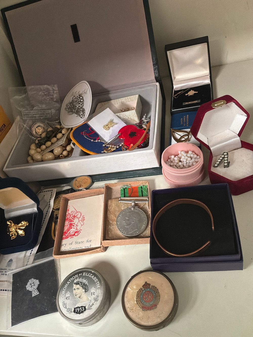 Lot 357: A Collection of World War II Militaria, Royal Commemoratives, and Costume Jewellery