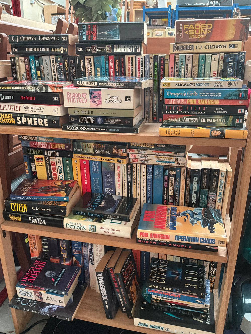 Lot 397: A Collection of Science Fiction and Fantasy Literature including Works by C.J. Cherryh, Arthur C. Clarke, and Isaac Asimov